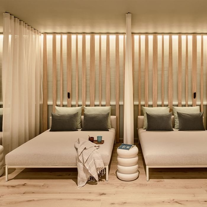 Two cozy beds in a room at Falkensteiner Hotel & Spa Carinzia