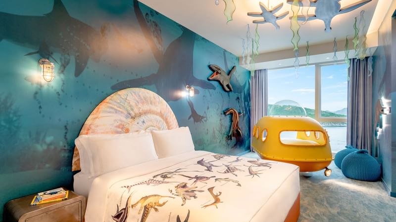 Cozy bed and sitting area in Jurassic Submarine Room at Fullerton Ocean Park Hotel Hong Kong