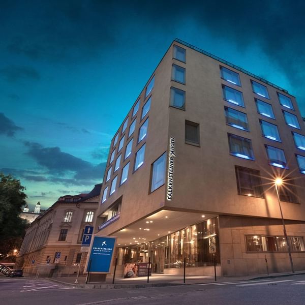 Law-angle exterior view of the Falkensteiner Hotel Bratislava building at night