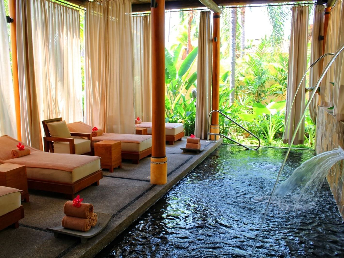 Spa beds by mini pool in Nakawè Spa at FA Puerto Vallarta