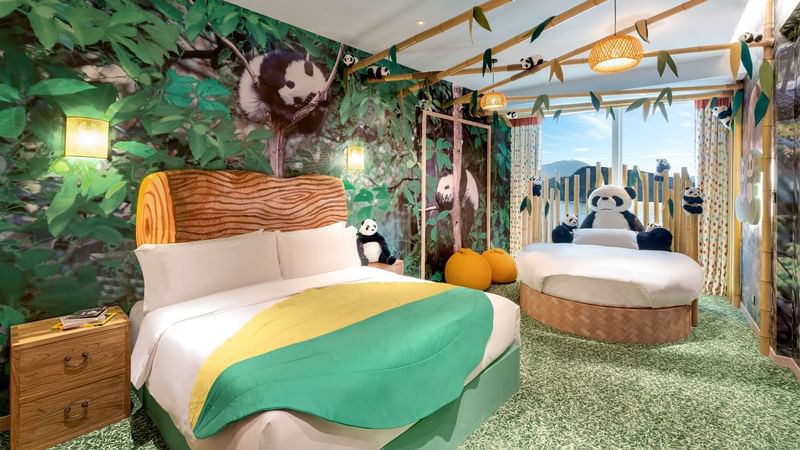 Comfy bed and sitting area in Panda Party Room at Fullerton Ocean Park Hotel Hong Kong