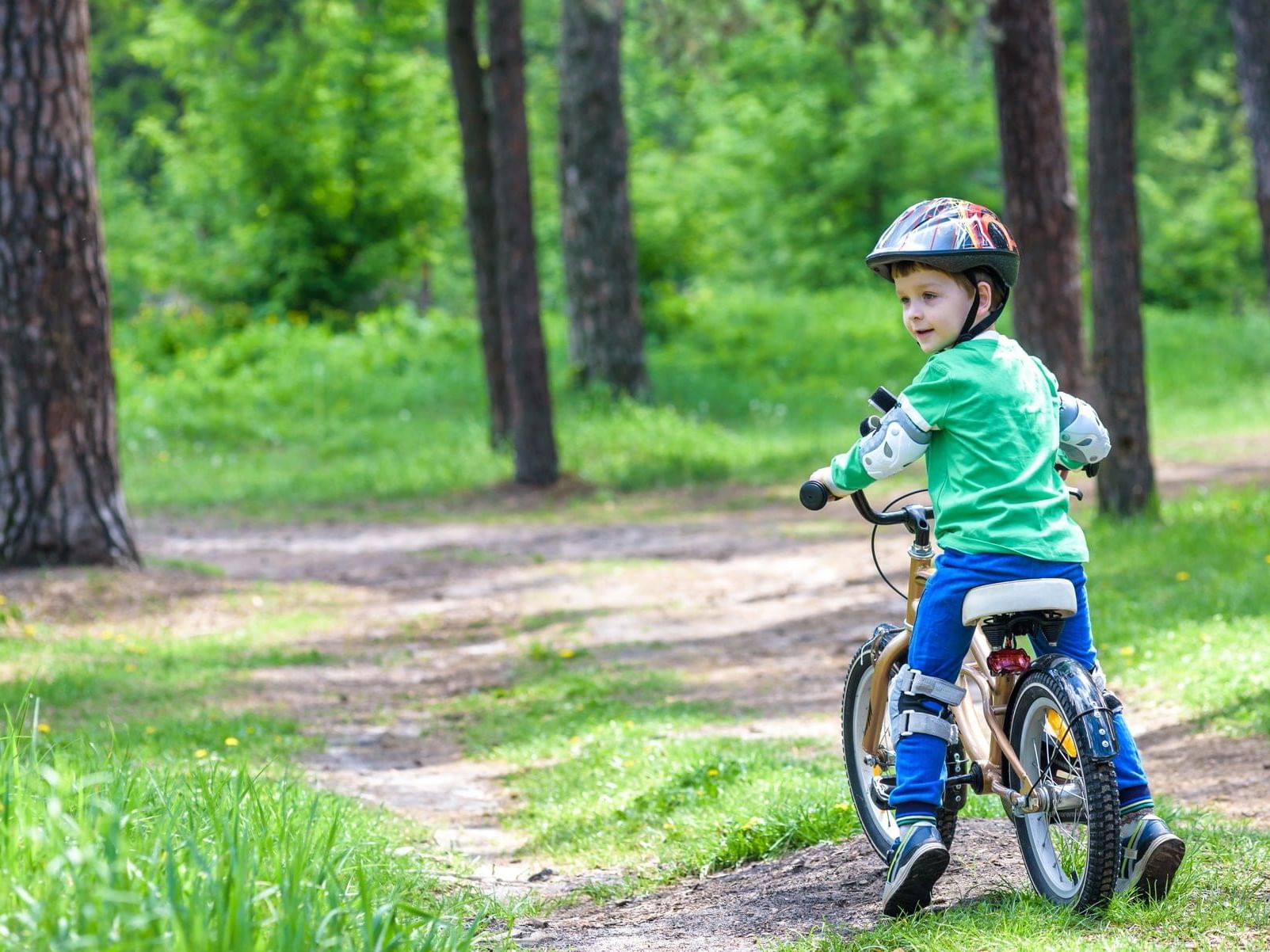 Kid cycling in the Xochitla park near Fiesta Americana Hotels
