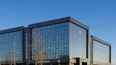 Exterior view of the hotel at Village Hotel Glasgow at sunset
