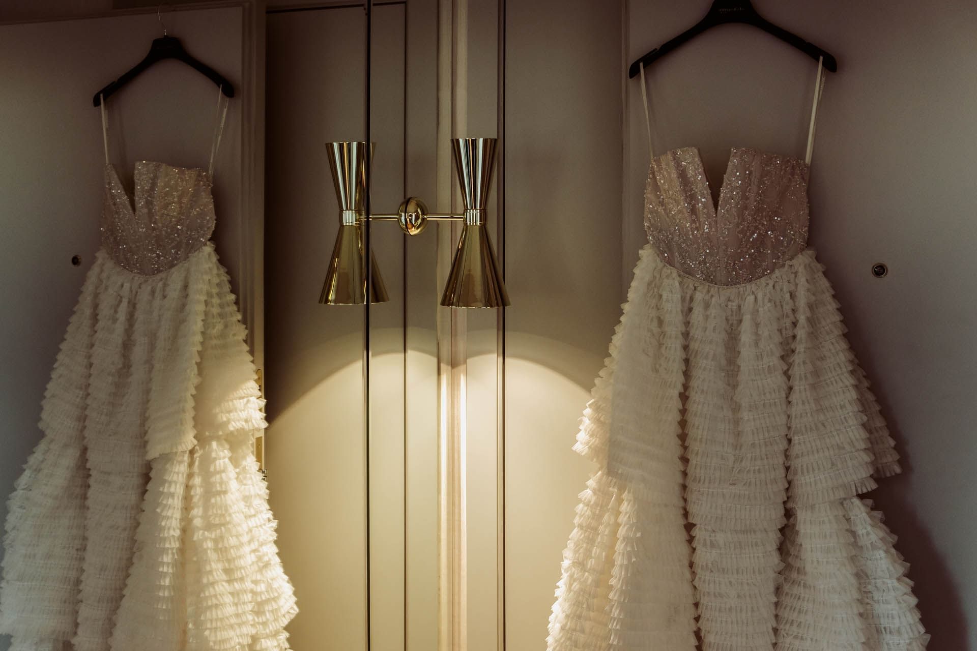 2 wedding frocks hanging at Almanac X Alcron Prague