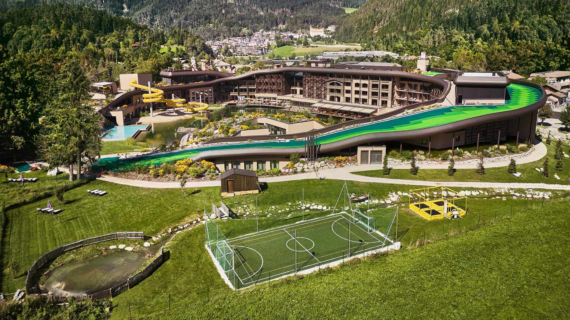 Aerial view of Falkensteiner Family Resort Lido with pools and water slides